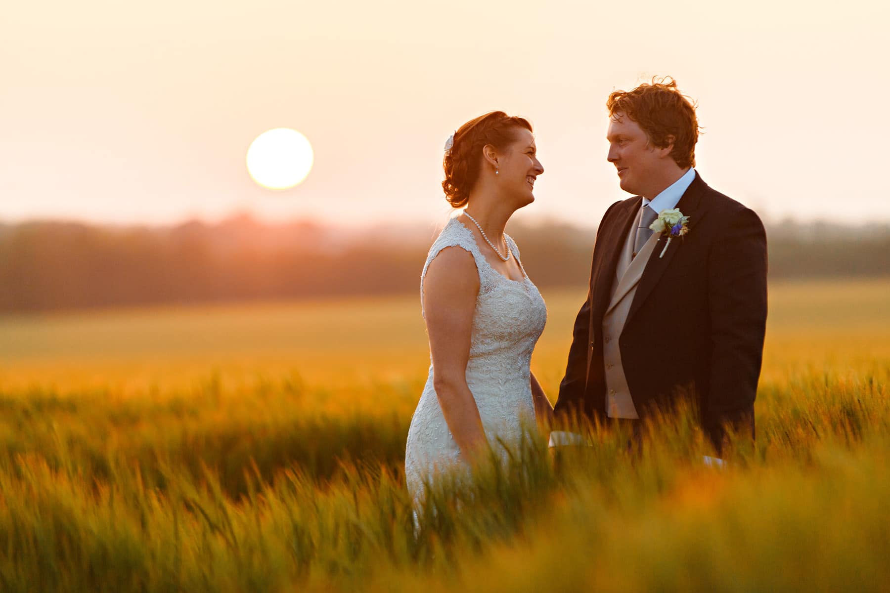 sunset couple photo in a norfolk field