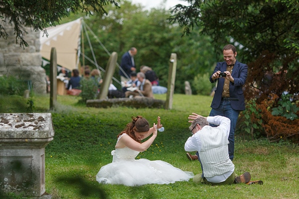 bride and groom hiding from the camera at their kent wedding