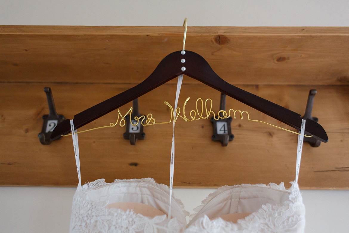 coat hanger for the wedding dress with the brides name on it