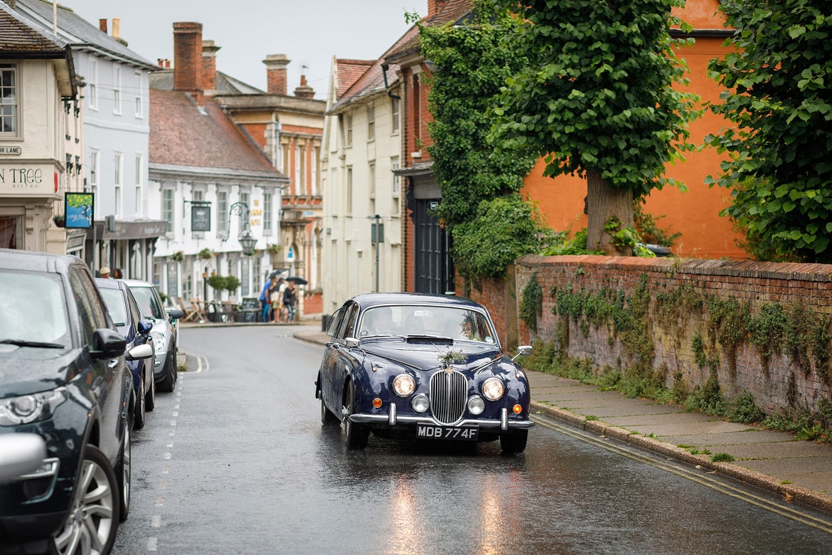 the bridemaids arrive in the rain