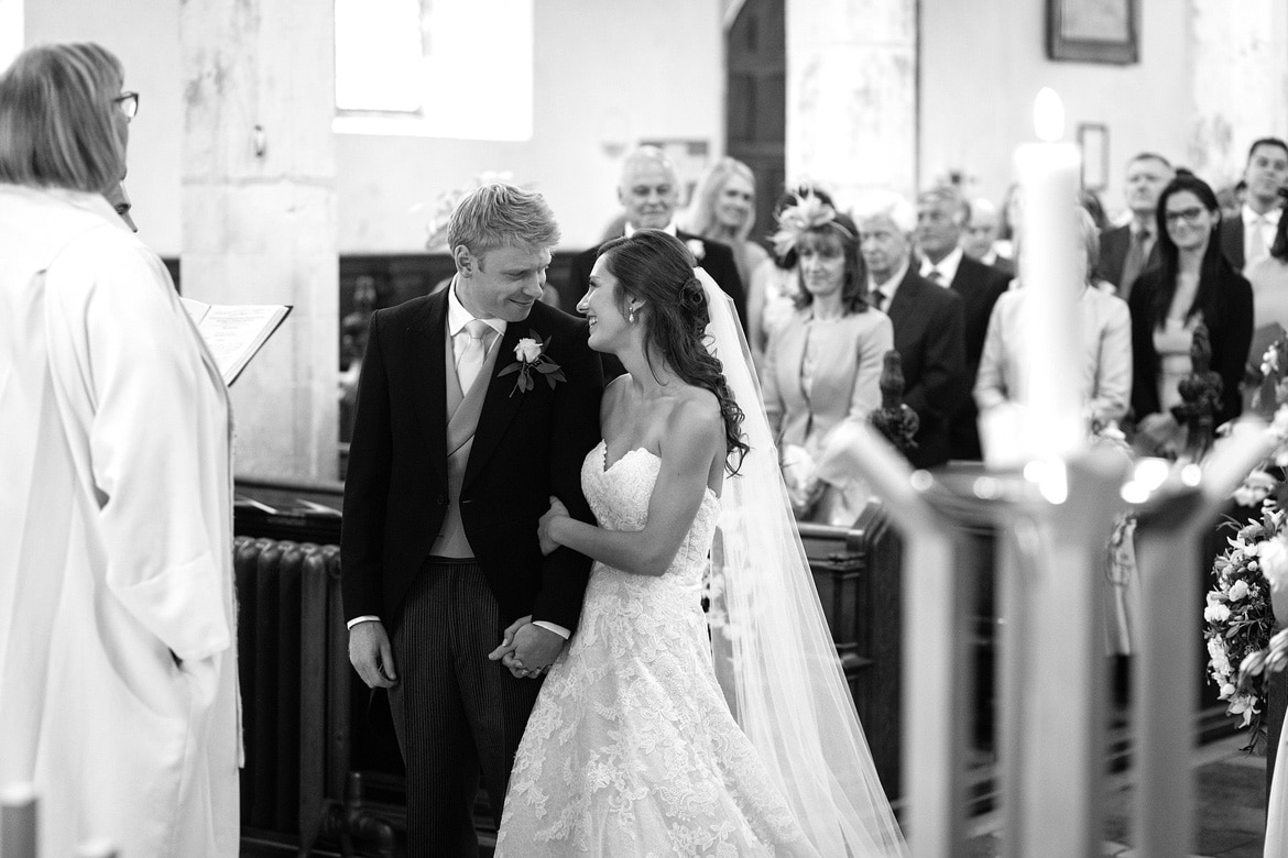 tom greets anna at the front of framlingham church