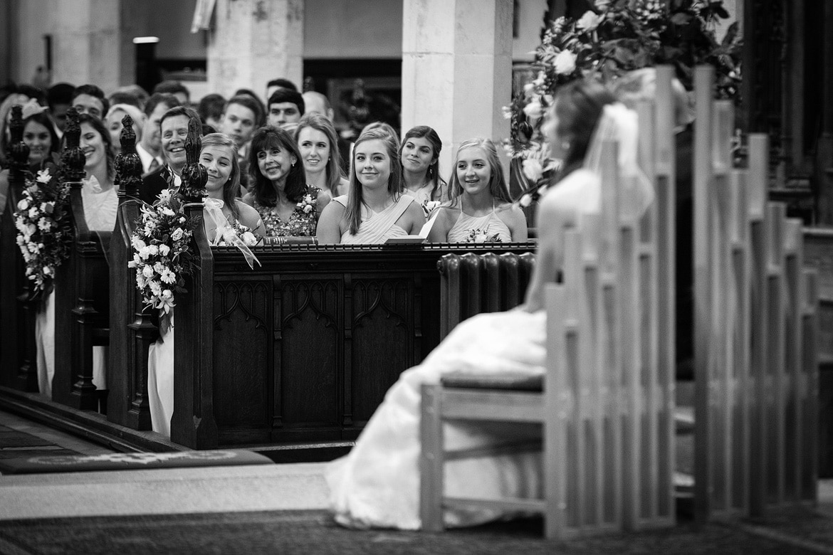 the bridesmaids smile at the bride