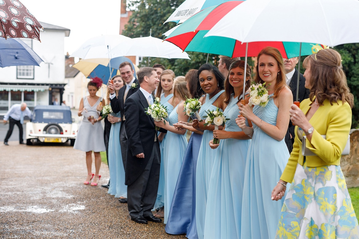 bridesmaids wait to throw confetti