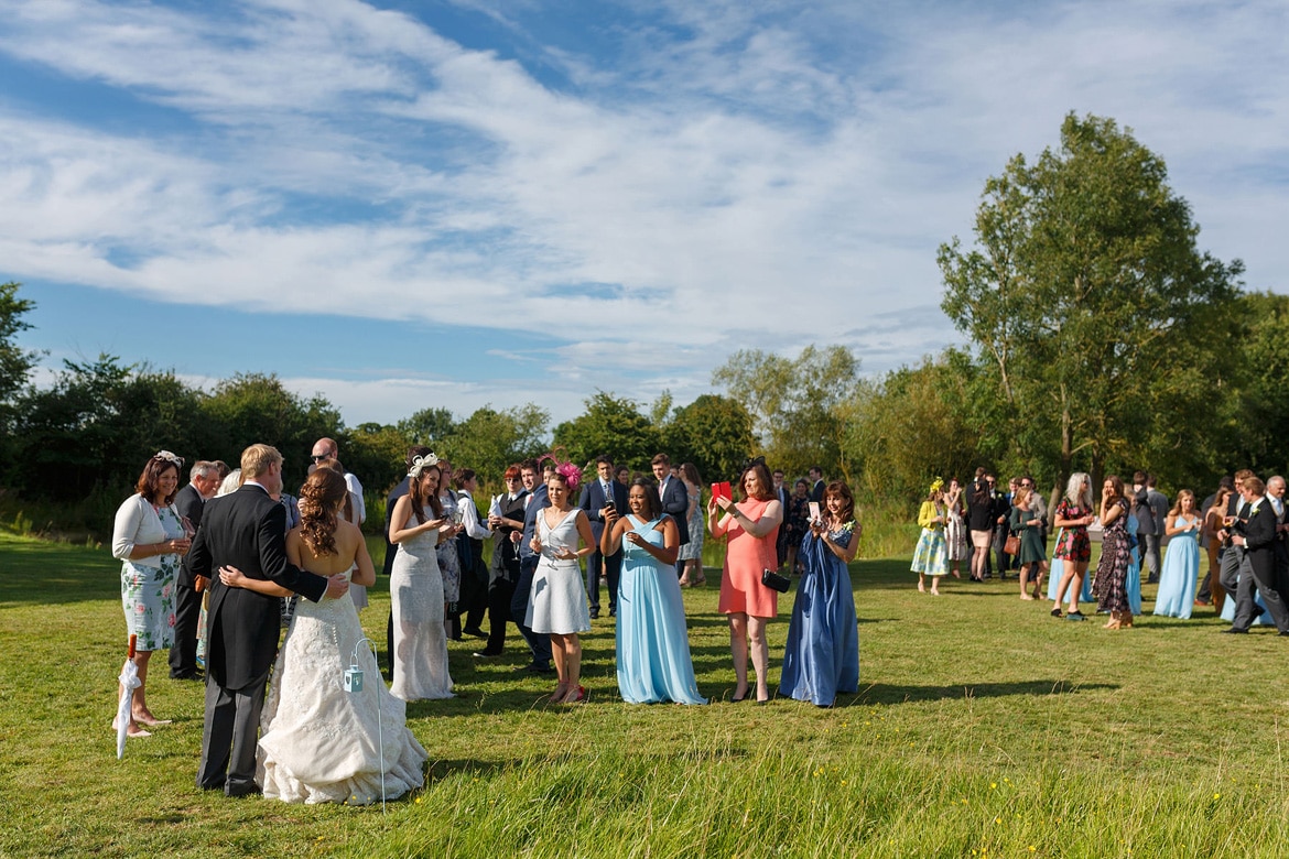 guests welcome the bride and groom to their reception