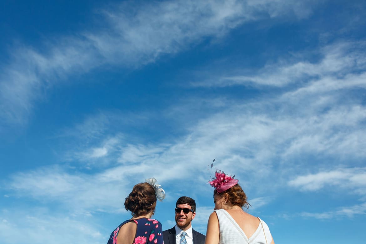 guests chat at a summer suffolk wedding