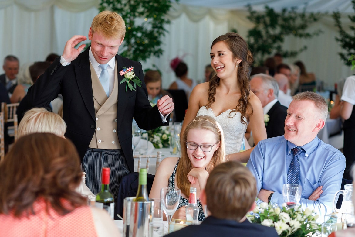 bride and groom talk with the wedding guests