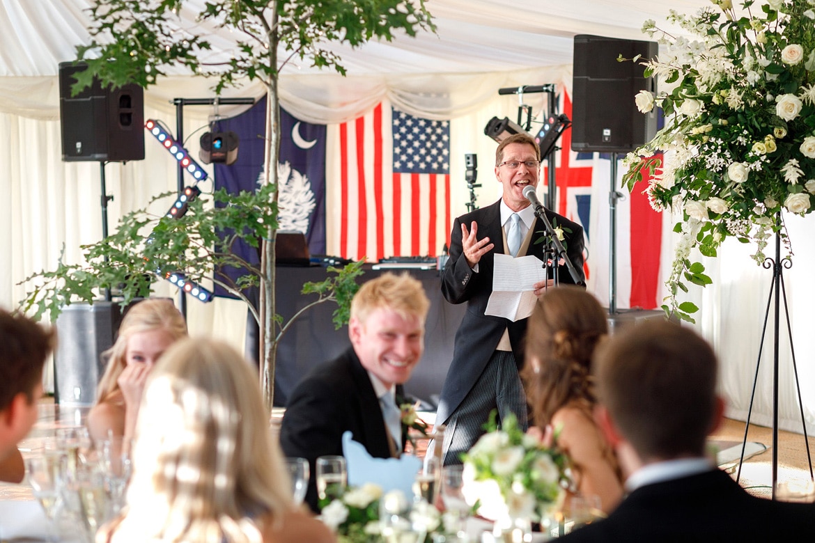 the brides father starts his speech at a suffolk marquee wedding