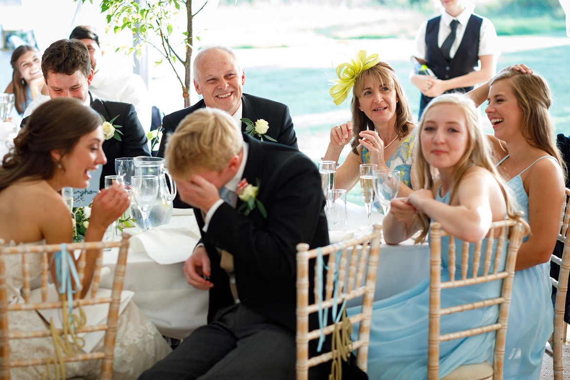 the grooms parents listen to the speeches