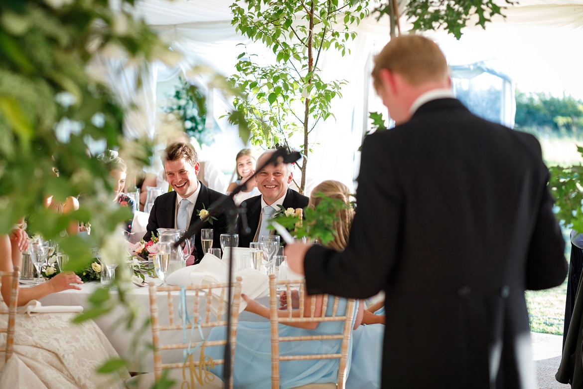 the grooms father laughs during his sons speech