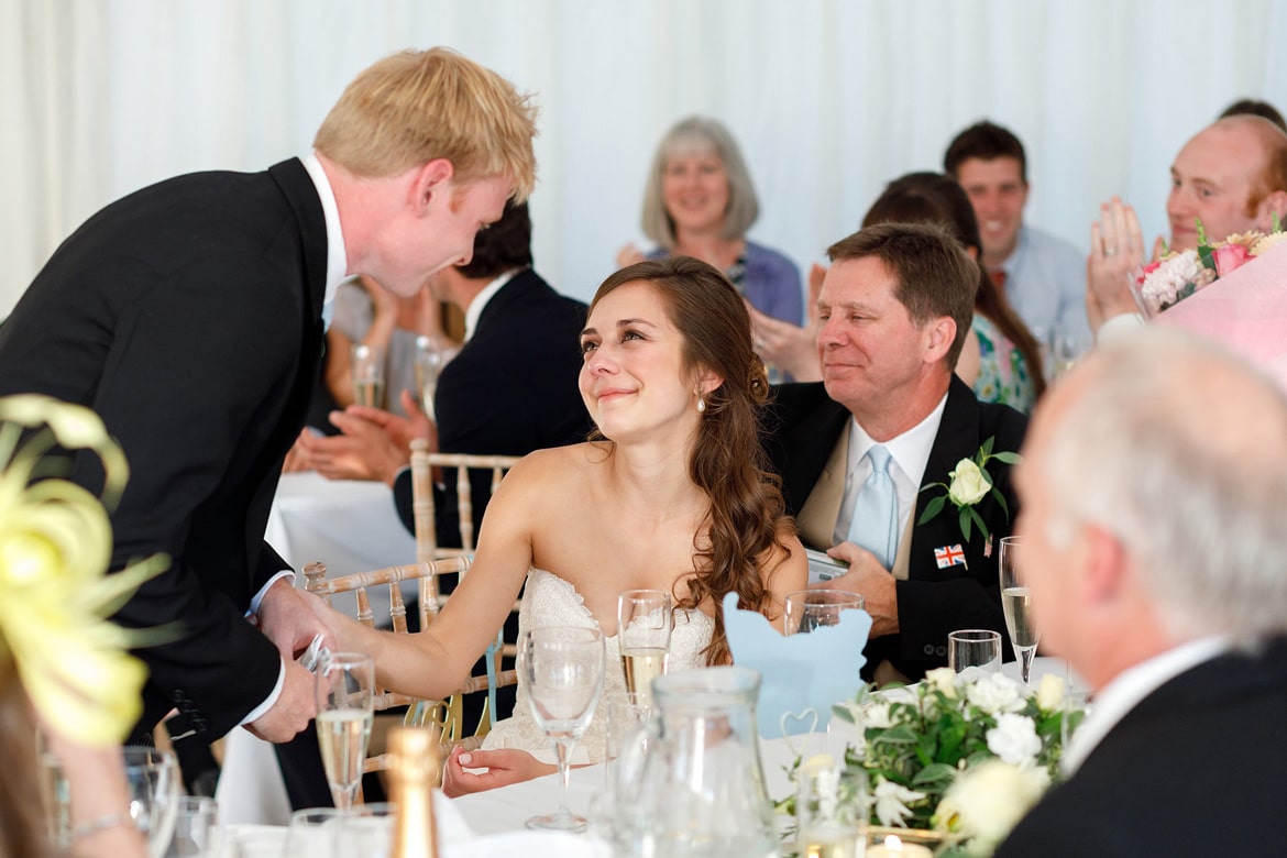 the bride smiles at the groom