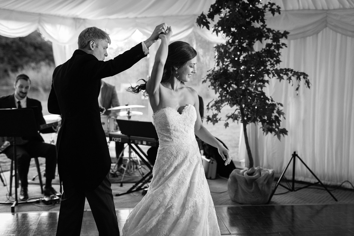 bride and groom spin on the dancefloor