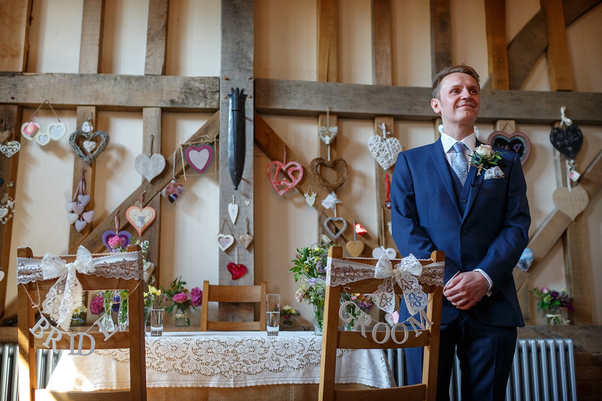 the groom waits inside gate street barn