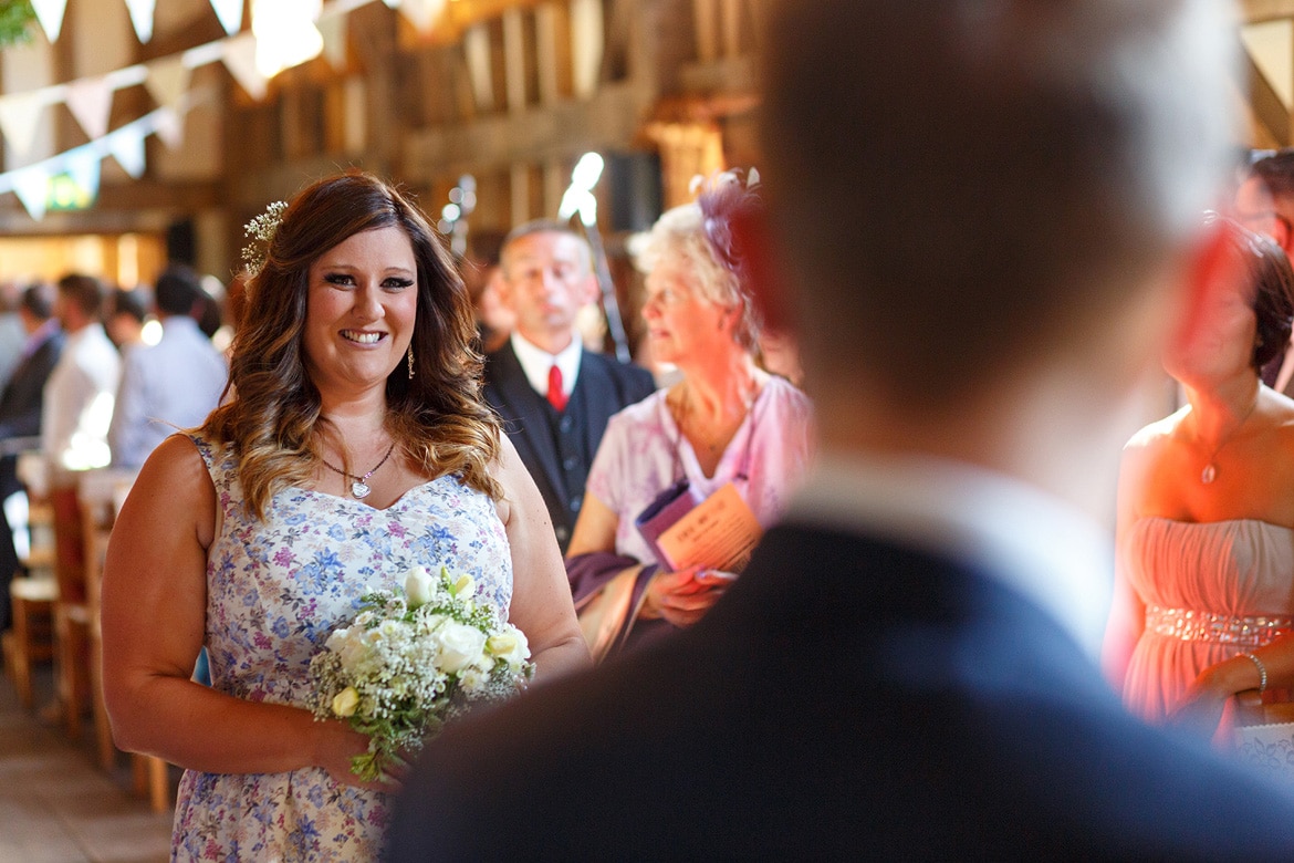 the bridesmaid walks down the aisle