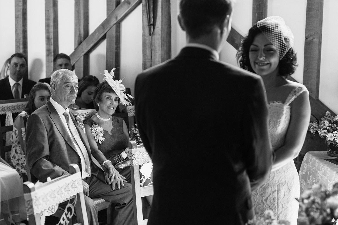 the brides parents look on