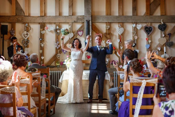 an ecstatic bride and groom after their gate street barn wedding ceremony