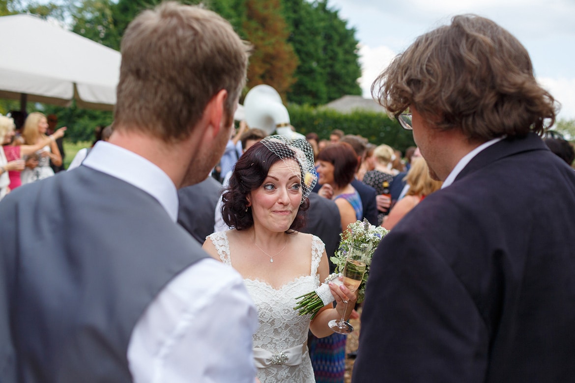 the bride speaking to guests