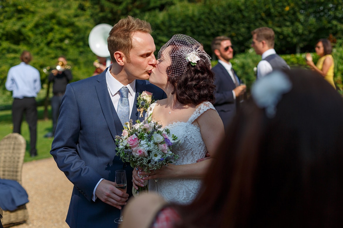 the couple kiss outside