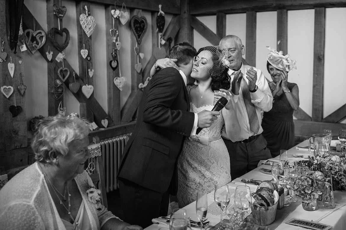 the bride kisses the groom