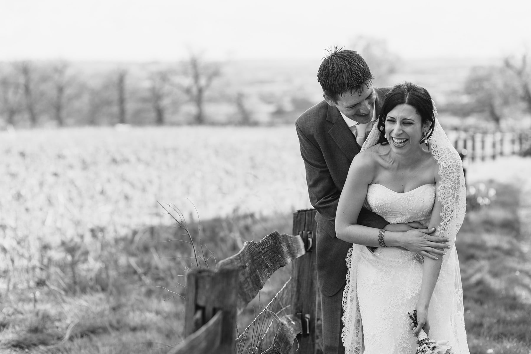 anna and steve laughing at their gaynes park wedding