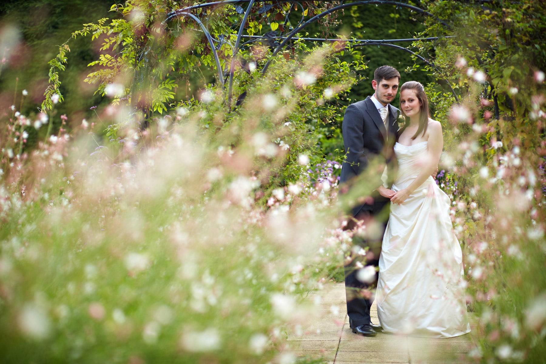 gaynes park wedding couple in the gardens