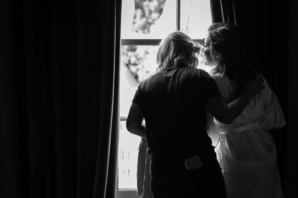 the bride looks out to see the groom