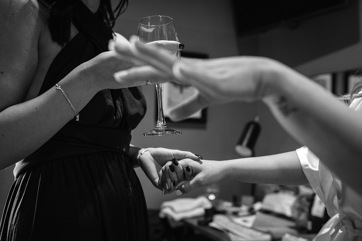 bride holding hands with the bridesmaid