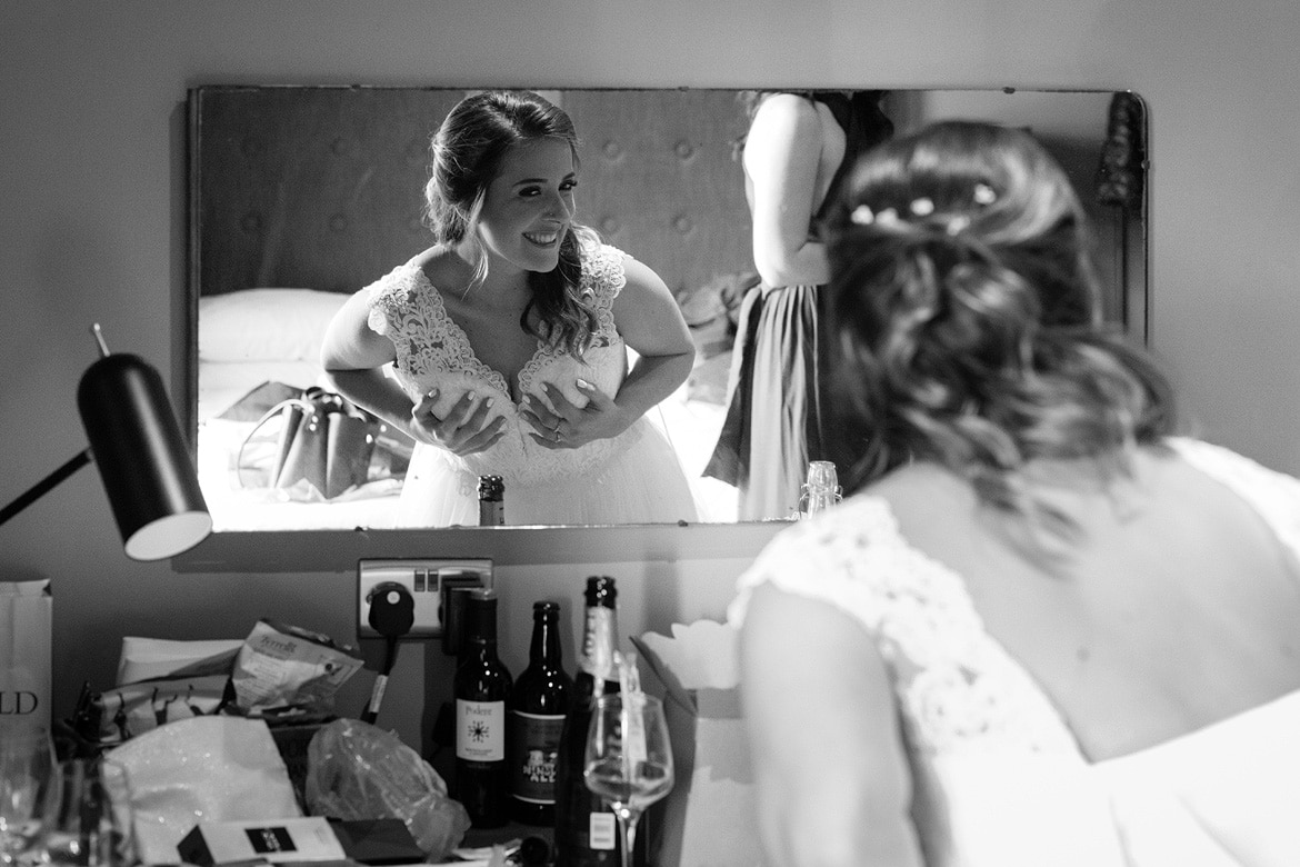 bride looking in the mirror