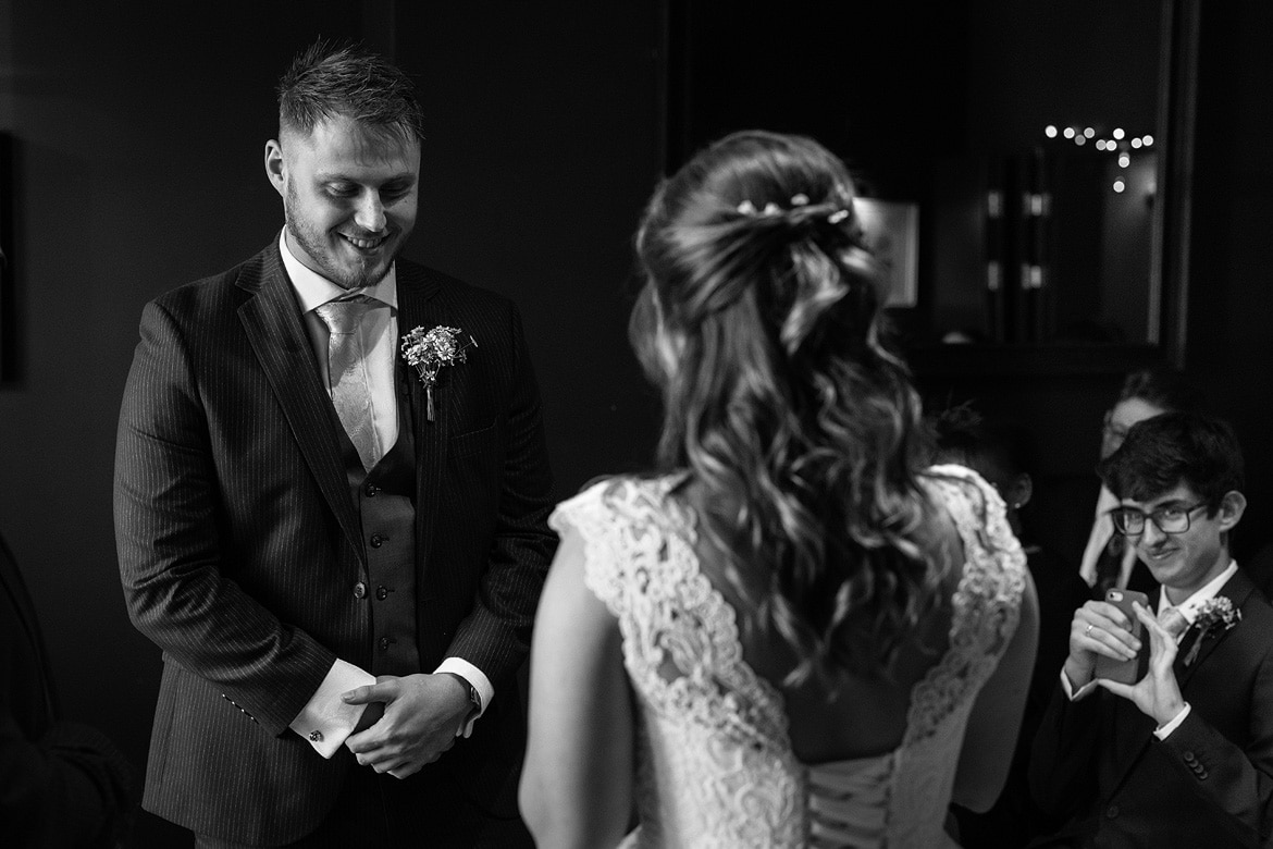 the groom smiles in the georgian townhouse wedding ceremony