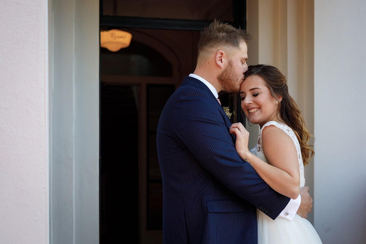 bride and groom outside their georgian townhouse wedding