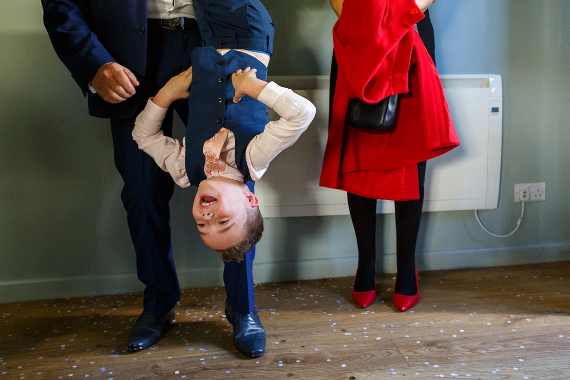 a page boy hangs upside down