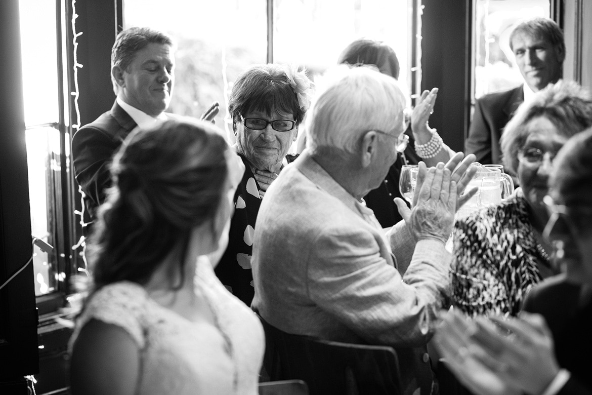 the bride smiles at a guest