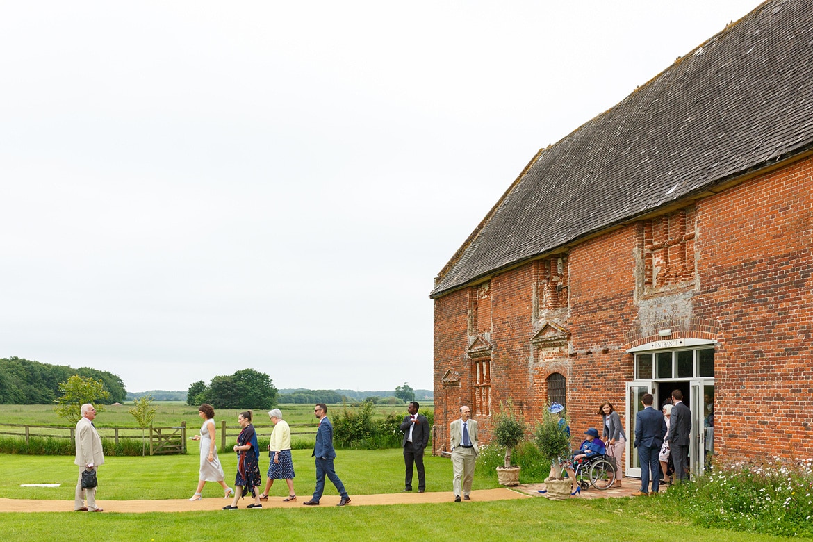 guests leave godwick barn for the wedding ceremony