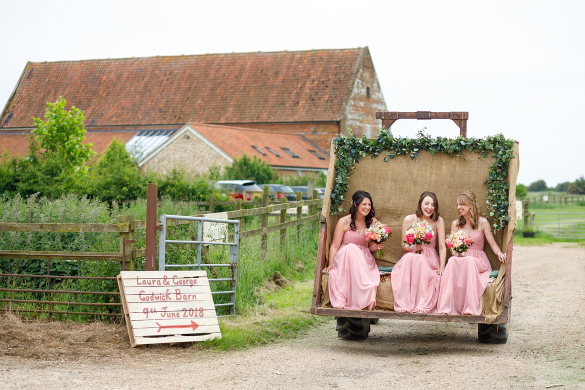 bridesmaids arrive on the godwick tractor