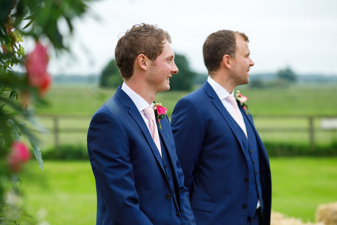 the groom and best man wait