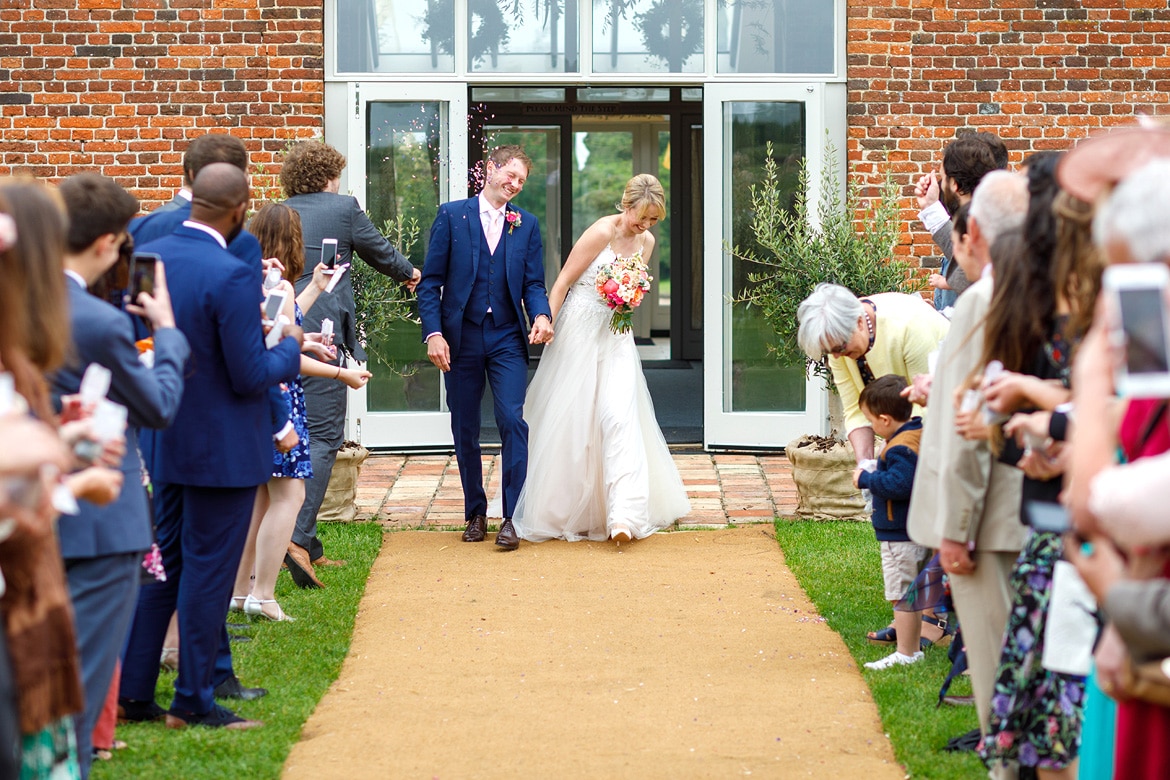 walking through the confetti outside godwick barn