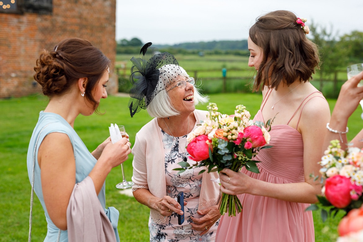 guests laugh at a godwick wedding