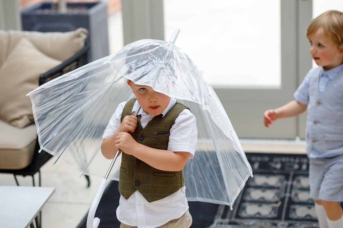 a young guest under an umbrella