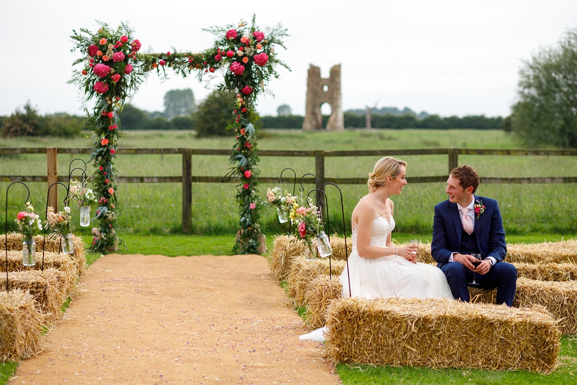 bride and groom share a moment outside godwick barn