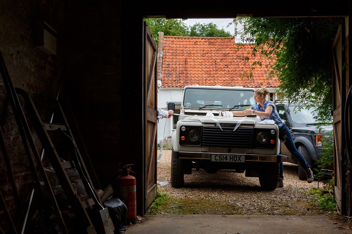 the bride dresses the landrover for the journey to her wedding at gressenhall