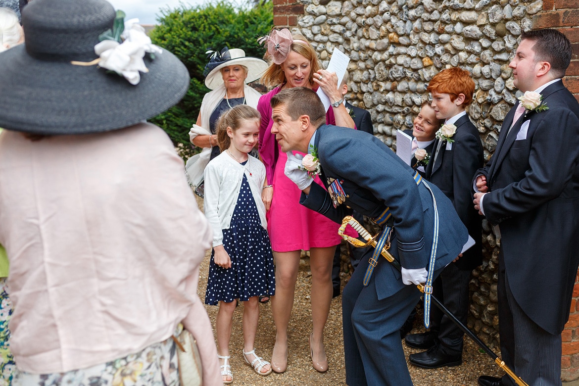ben greets some children before the ceremony