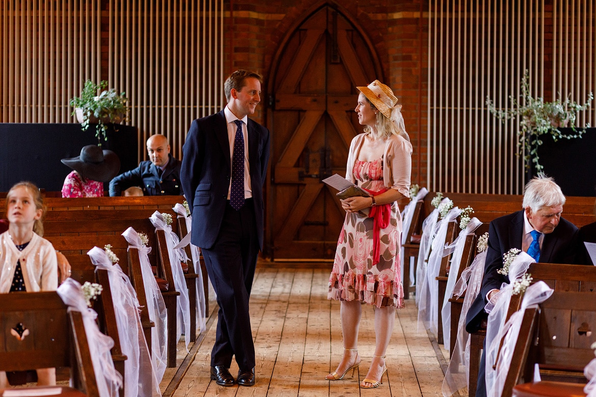 guests chat in the aisle of gressenhall chapel