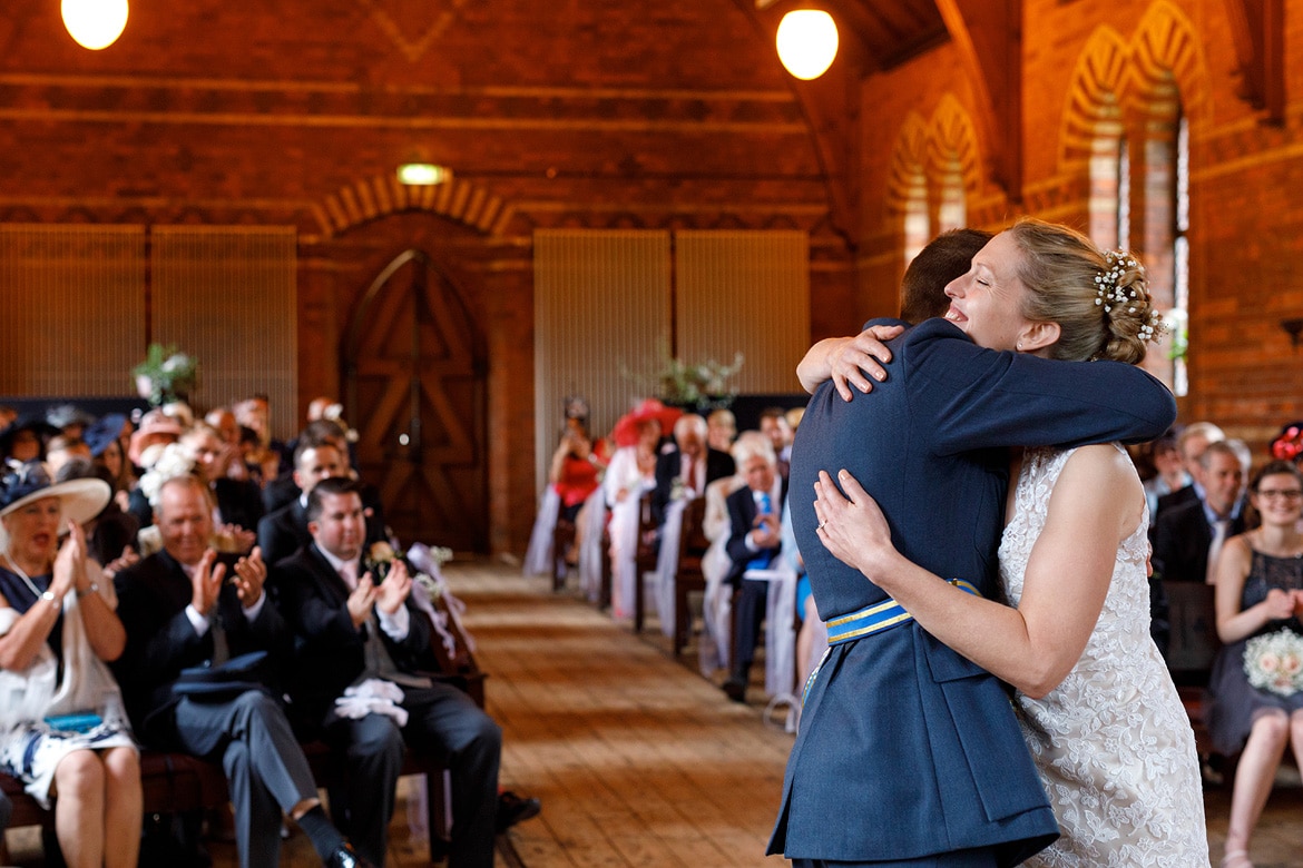 bride and groom embrace