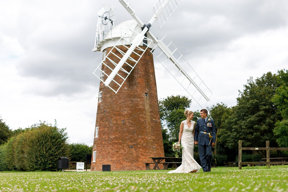 bride and groom in front of dereham windmill