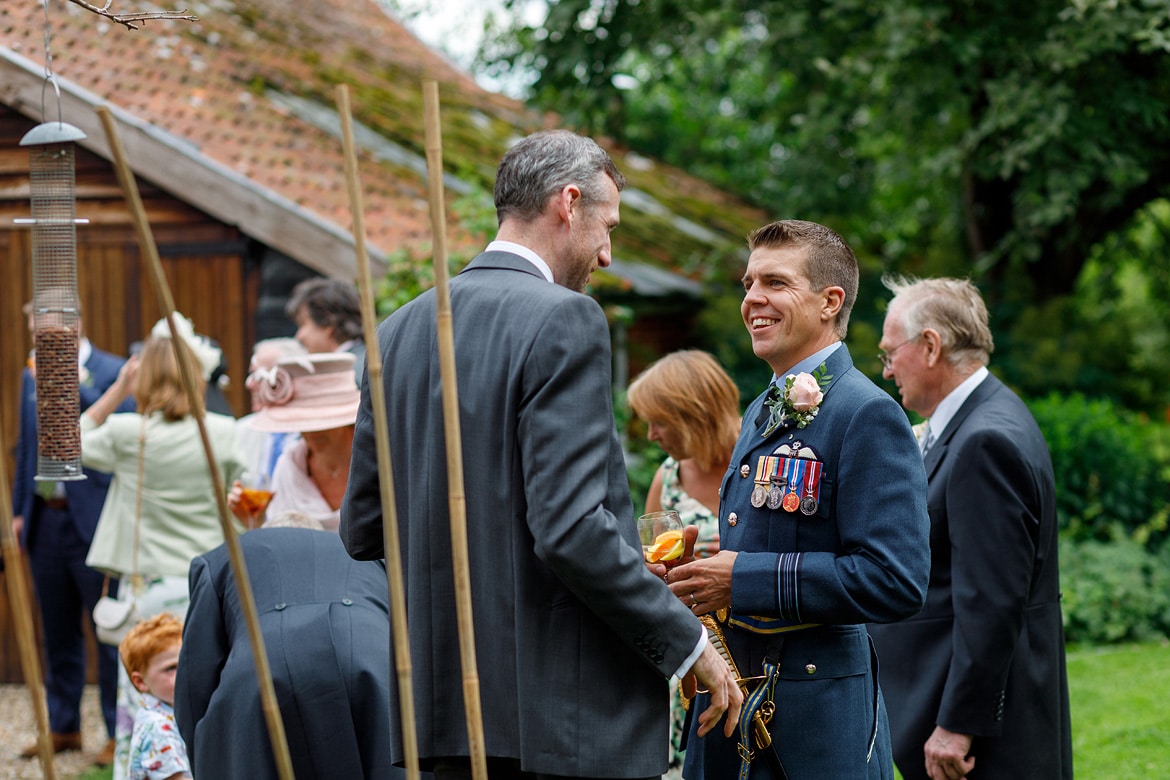 the groom talks to his guests