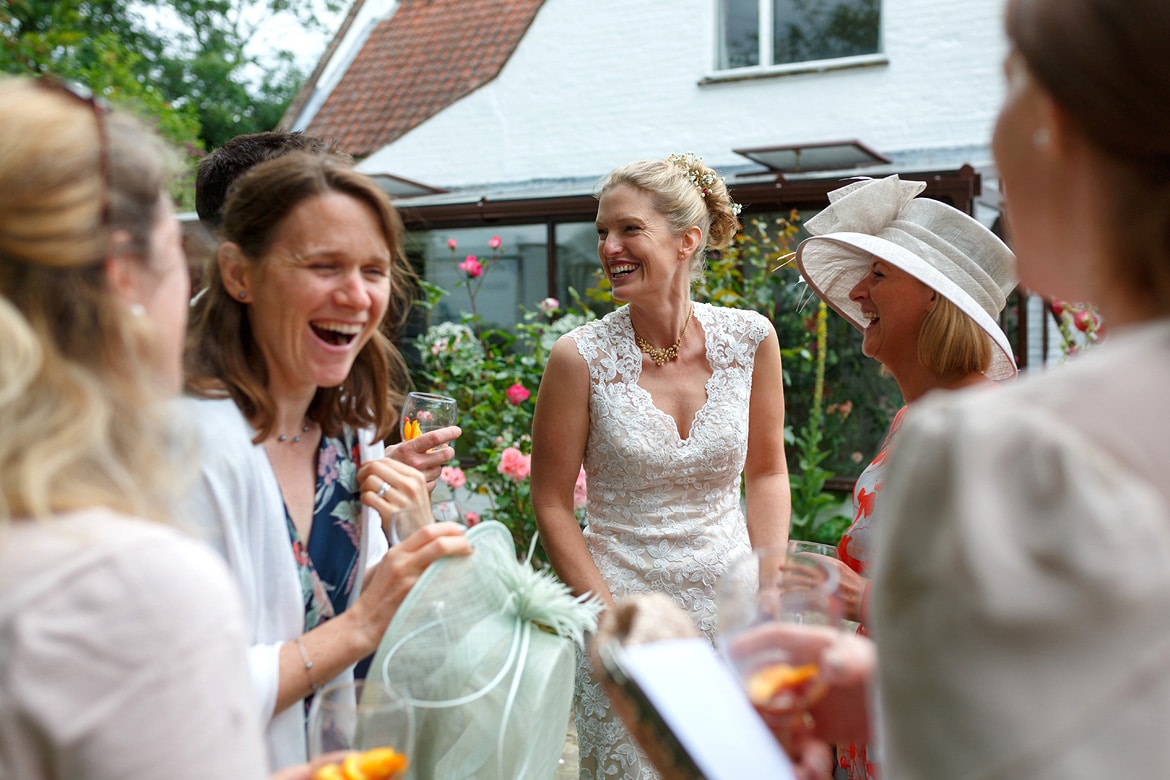 the bride chats with guests