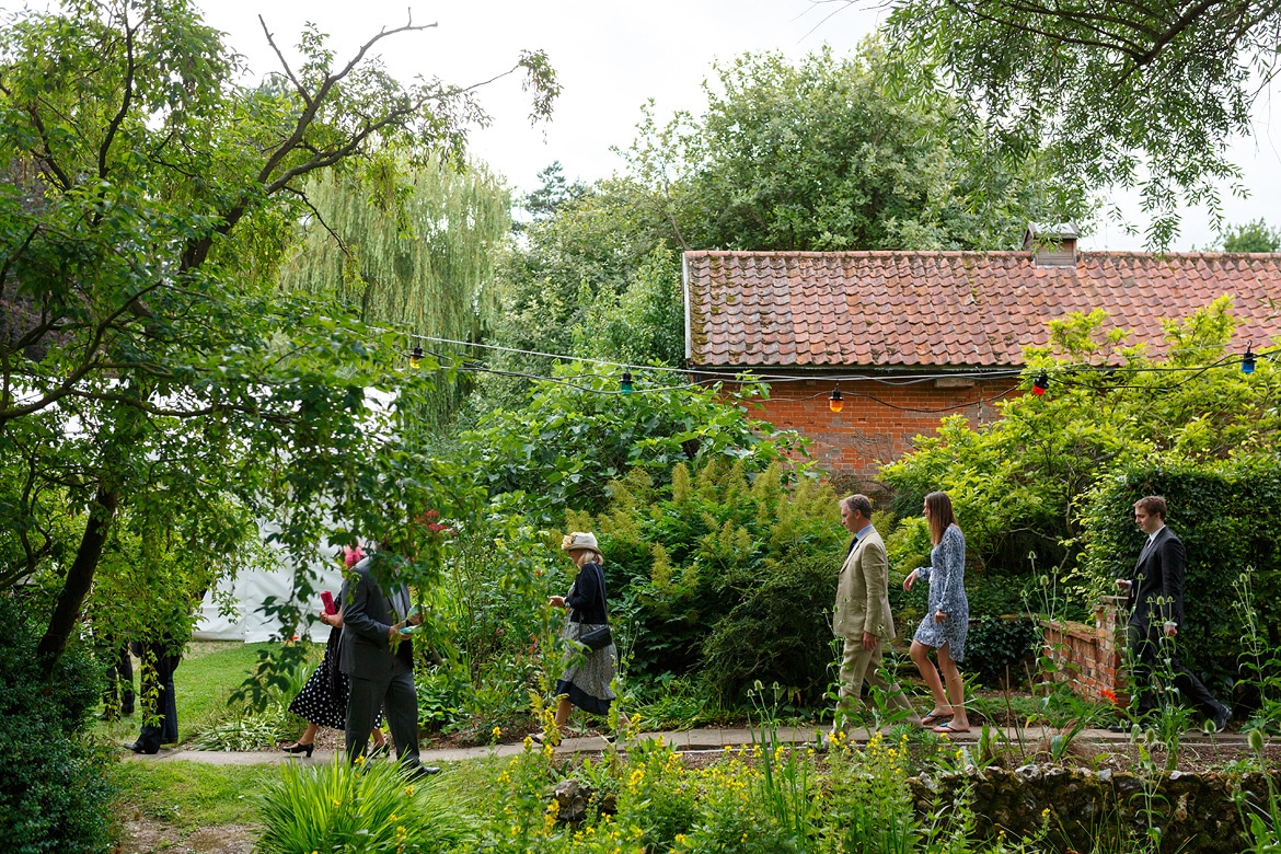 guests walk to the marquee