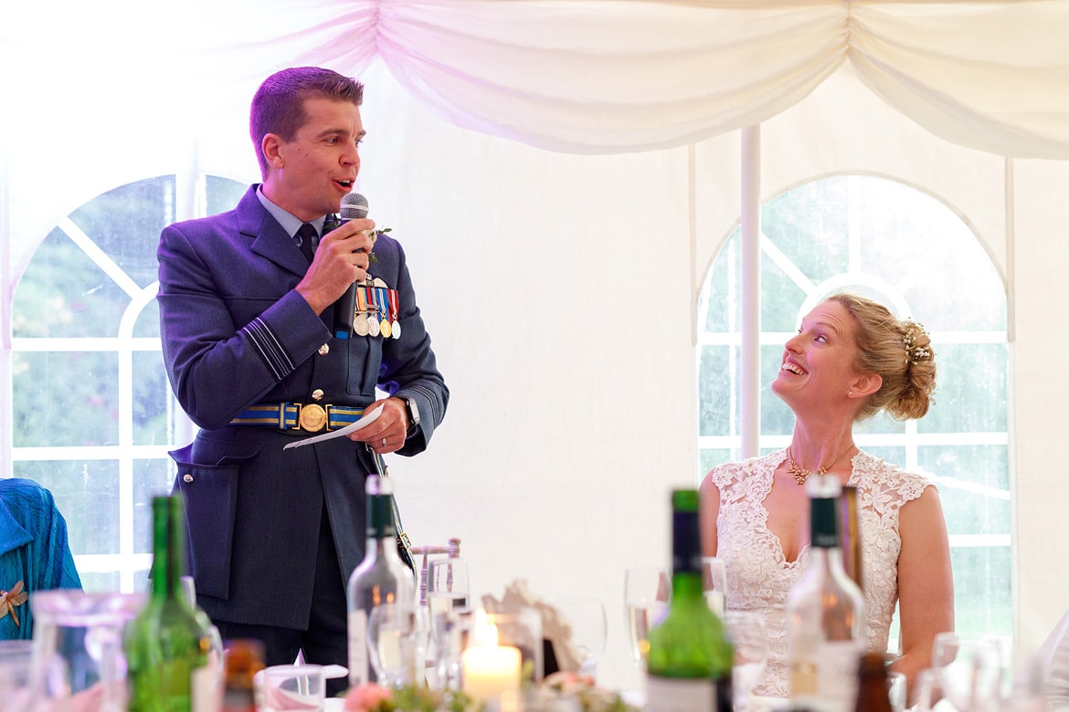 the bride laughs at the grooms speech