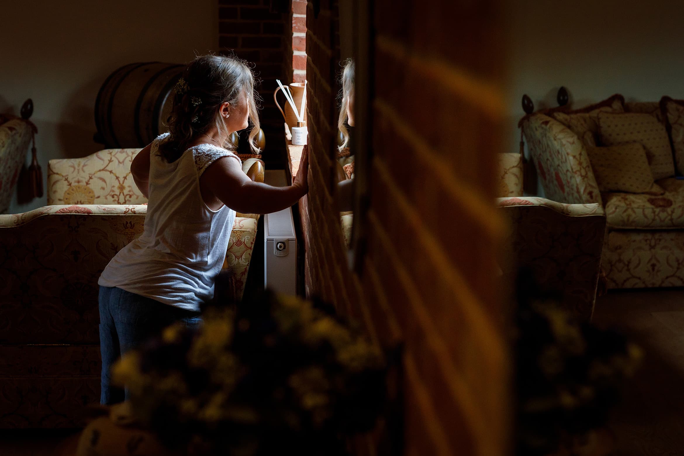 the bride looking out of the window at hautbois hall