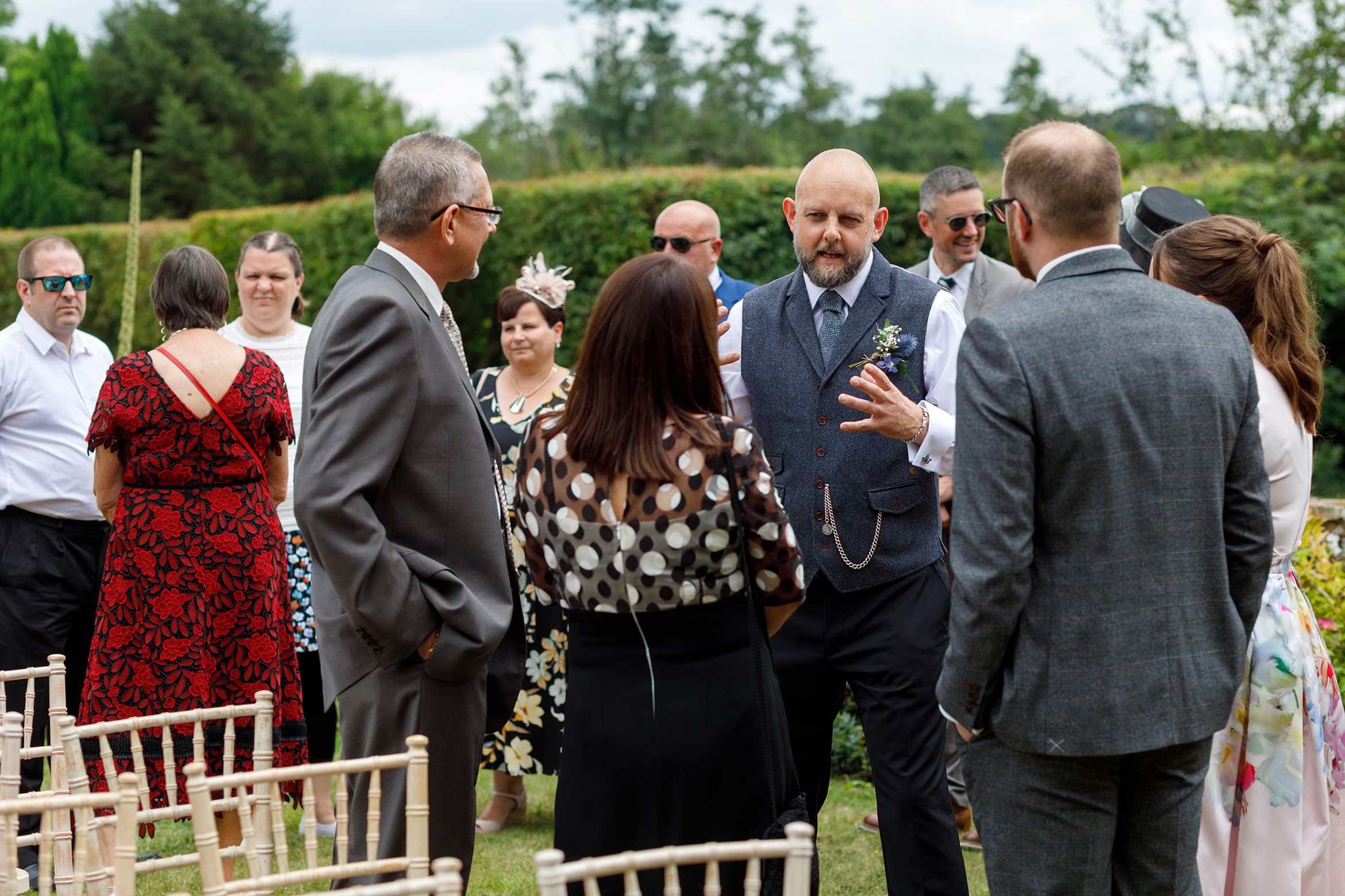 the groom talks to his guests