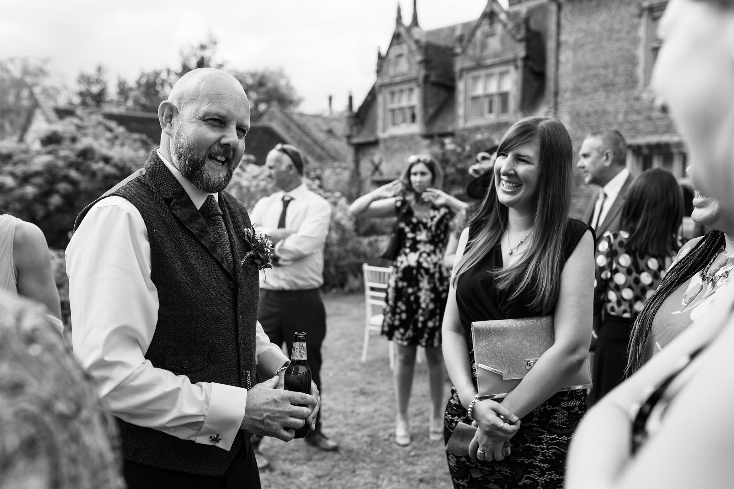 the groom talks to his guests